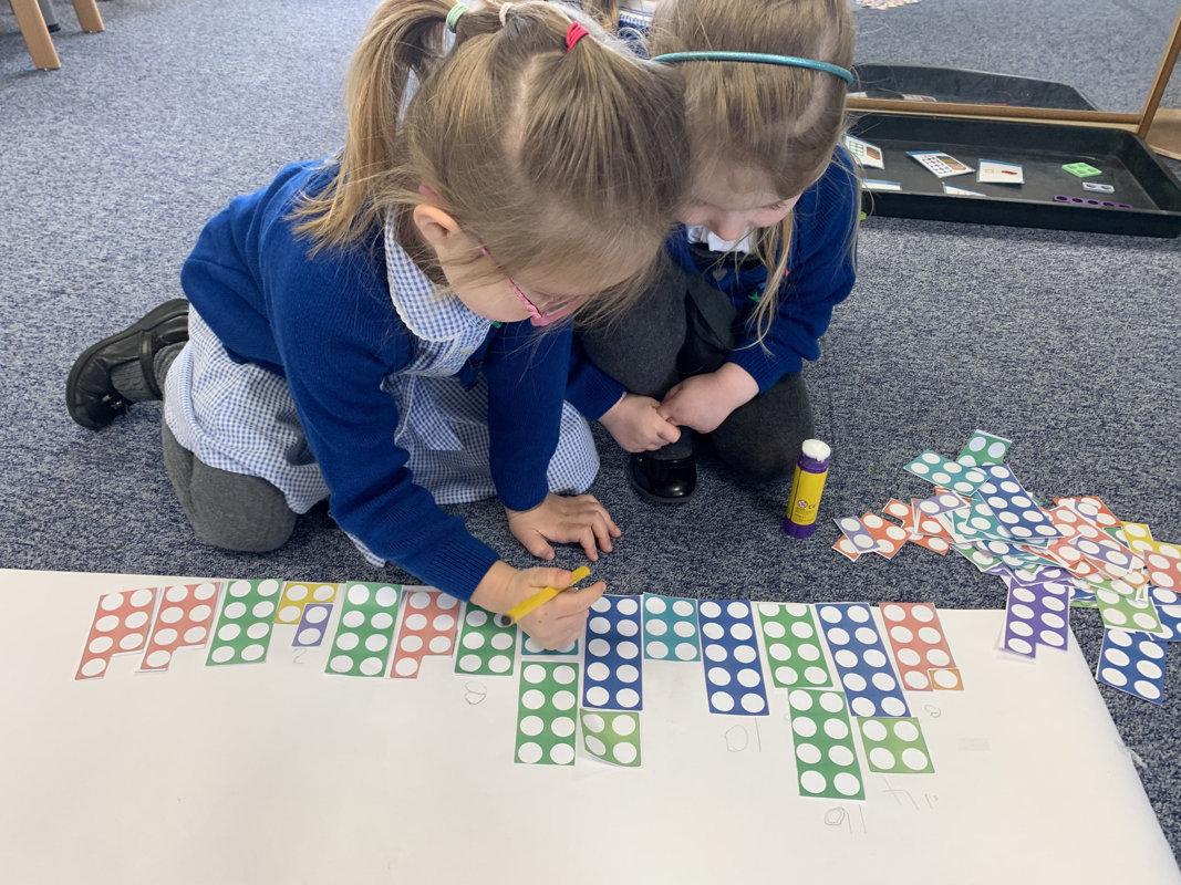 Image of Reception class working hard in Maths!